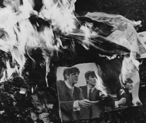 Posters, albums and other memorabilia of the Beatles are burned in a bon fire protesting John Lennon's statement that the Beatles were now more popular than Jesus, in Fort Oglethorpe, Georgia, Aug. 12, 1966. (AP Photo)